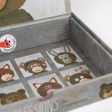 Cardboard box with small cards featuring cartoon animal faces on a white background