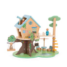 Toy treehouse with various accessories on a white background