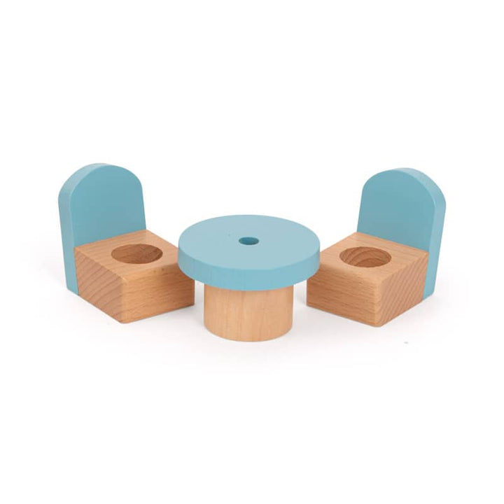 Set of wooden chairs and a table with blue seats and beige bases on a white background
