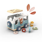 Wooden toy van with animal figures and shape sorter on a white background