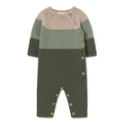 A baby knit romper in horizontal color-blocked stripes of beige, sage green, and dark olive green, featuring wooden buttons on the side and crotch.