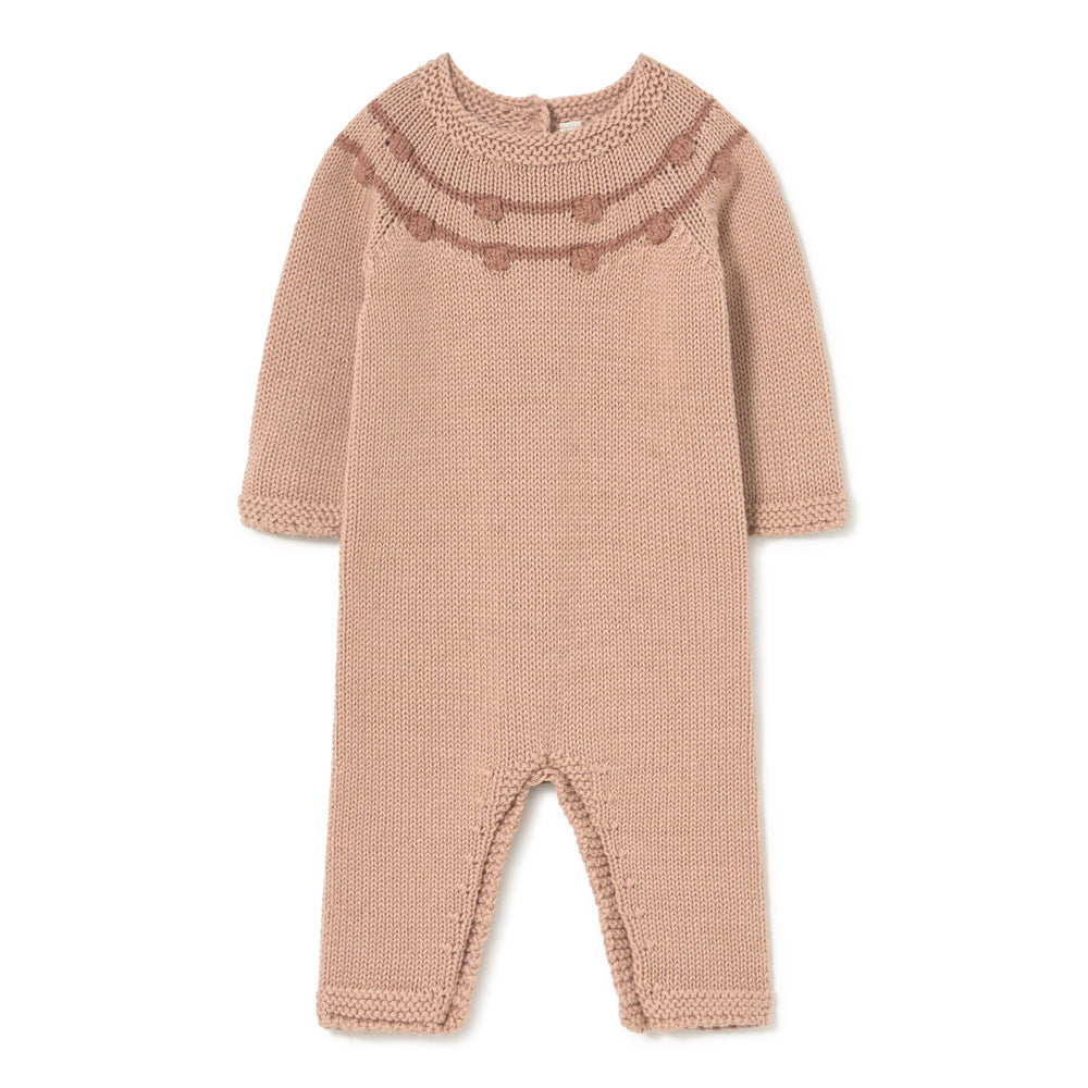 A long-sleeve knit baby jumpsuit in a dusty rose pink color, featuring a textured heart pattern across the chest and matching ribbed trim on the collar, cuffs, and foot openings, shown flat on a white background.
