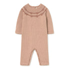 A long-sleeve knit baby jumpsuit in a dusty rose pink color, featuring a textured heart pattern across the chest and matching ribbed trim on the collar, cuffs, and foot openings, shown flat on a white background.
