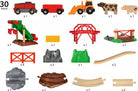Collection of toy farm and track pieces on a white background