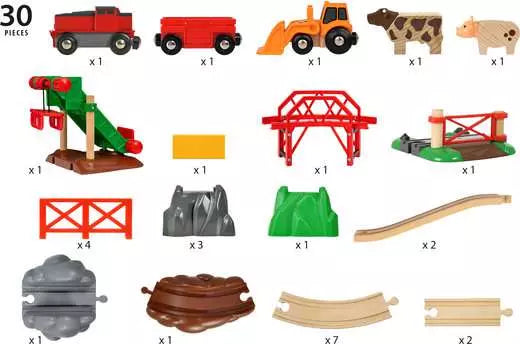 Collection of toy farm and track pieces on a white background