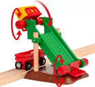 Toy train track with a green and red adjustable crossing gate on a white background