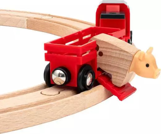 Wooden toy train set with red wagon and animal figure on a white background