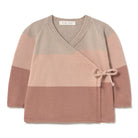A children's knit wrap cardigan sweater with horizontal color-blocked stripes in beige, dusty pink, and mauve, featuring a crossover V-neck and a side tie detail. The brand label 'li & me' is visible inside the collar.