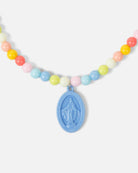Necklace with colorful beads and a blue religious pendant on a white background