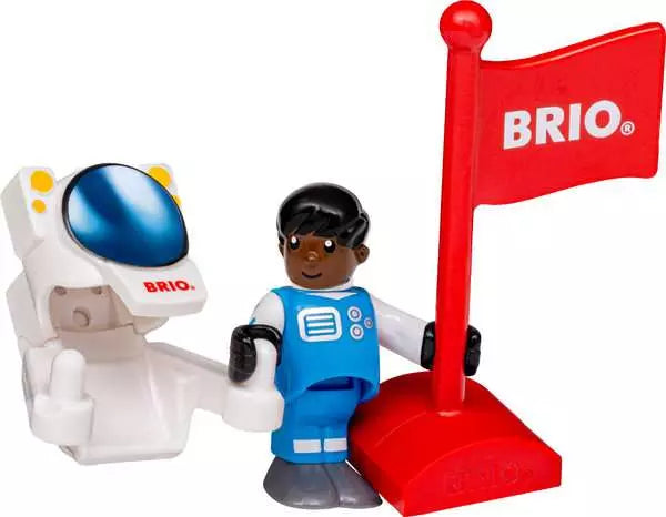 Brio World astronaut figure wearing a blue and white spacesuit standing next to a white spacesuit with a blue visor, accompanied by a large red flag bearing the white Brio logo on a red base.