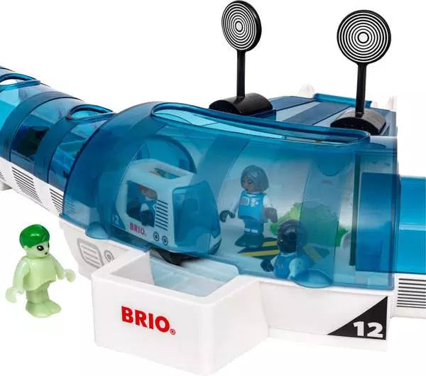 The Space Deluxe Set by Brio space station with a white and blue base featuring the BRIO logo, a translucent blue canopy, a parked space train inside, and a glow-in-the-dark alien figure standing outside.