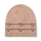A light beige knit beanie hat featuring horizontal stripes and six pom-poms on the front cuff, set against a plain white background.