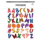A sheet of fruit-themed alphabet stickers by Pippistickers, featuring colorful letters shaped like watermelons, bananas, oranges, apples, and other fruits on a white background.