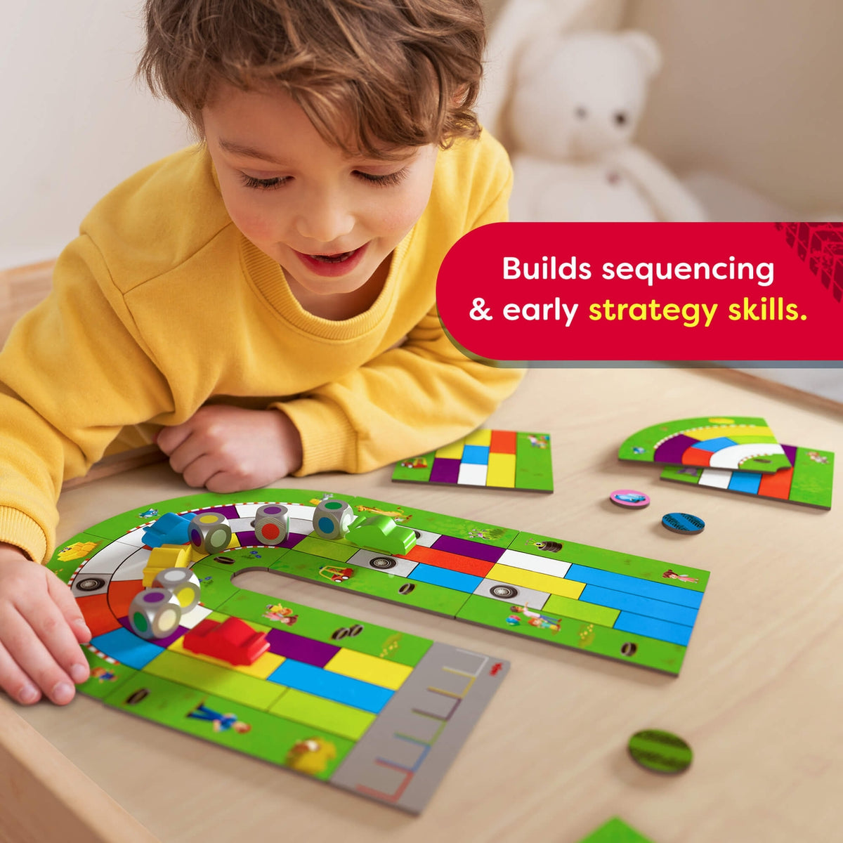 Child playing with a colorful board game on a wooden table.