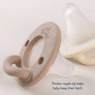 Teething ring with a thicker nipple tip on a light background