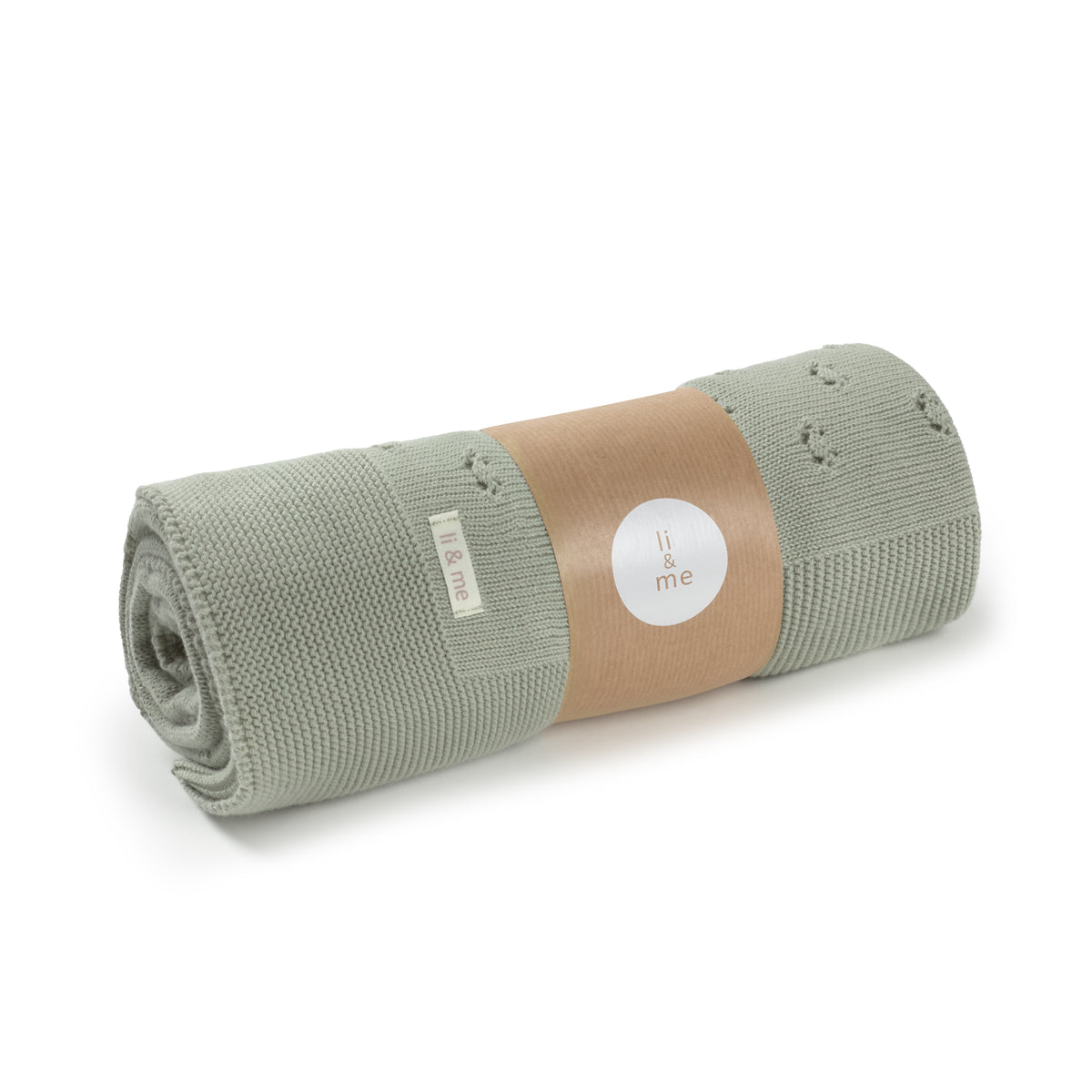 Roll of green fabric with a brown label on a white background
