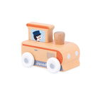 A wooden toy train with a natural light wood body, orange-painted accents, white wheels, and a small illustrated window showing a cartoon figure. The side of the train is partially painted 'Janod'.