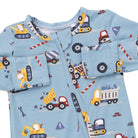 Children's pajama set with construction vehicle pattern on a light blue background