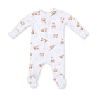 A baby long-sleeve footed sleeper in white with an all-over print of brown foxes and small pinecones, laid flat on a white background.
