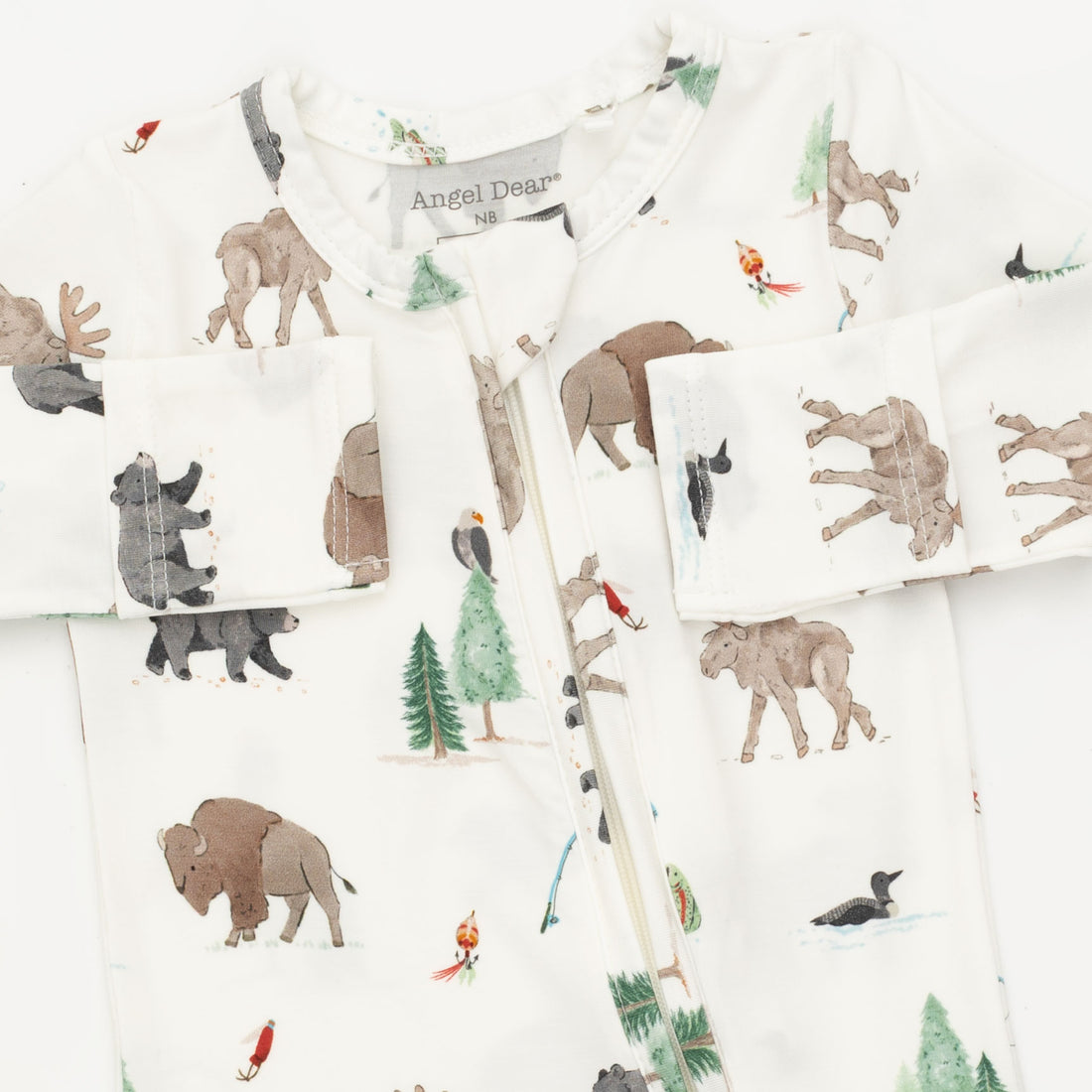 A close-up of a baby zip-up sleeper by Angel Dog, featuring an all-over safari animal print on a white background. The print includes brown bison, gray bears, green pine trees, and small red and orange birds.