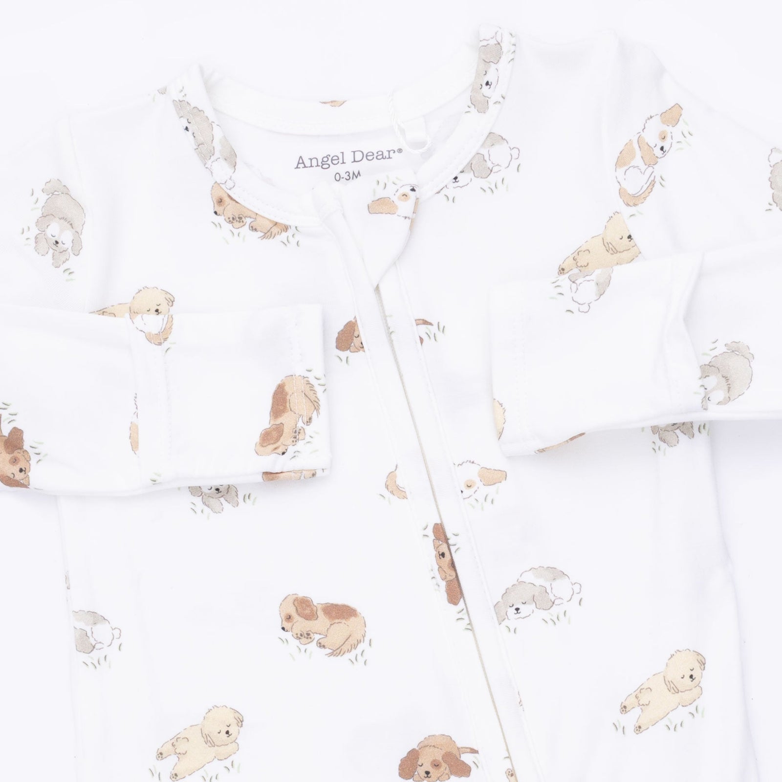 White baby sleep sack with an all-over print of small puppy illustrations in beige and brown, featuring a snap-button front and long sleeves.