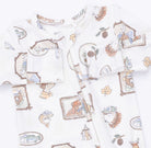 A baby long-sleeve romper in white, featuring a whimsical cartoon animal and nature print including bears, fish, pinecones, and leaves in soft brown, beige, and muted blue tones.