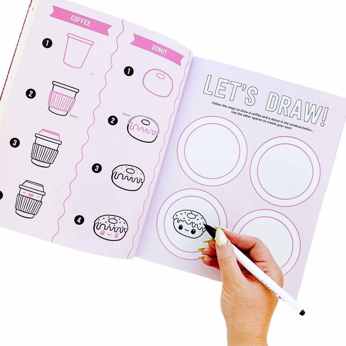 Illustration of a drawing book with coffee and donut illustrations, being used with a pen.