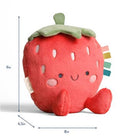 Plush strawberry toy with smiley face and measurements on a white background