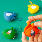 Colorful keychains with cartoon character on a green background