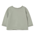Light green ribbed sweater on a white background