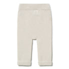 Beige knitted baby pants on a white background