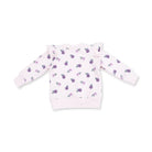 A light pink long-sleeve sweatshirt for toddlers, featuring an all-over print of small purple flowers with green leaves and ruffled details on the shoulders, shown against a plain white background.