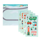 A product photo of the Christmas Town Mini Sticker Set by Petit Collage featuring a snowy landscape backdrop displayed alongside multiple vertical green sticker sheets with festive illustrations of holiday buildings, vehicles, and characters.