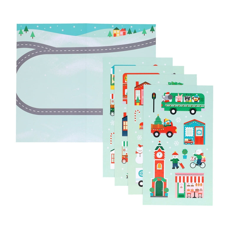 A product photo of the Christmas Town Mini Sticker Set by Petit Collage featuring a snowy landscape backdrop displayed alongside multiple vertical green sticker sheets with festive illustrations of holiday buildings, vehicles, and characters.