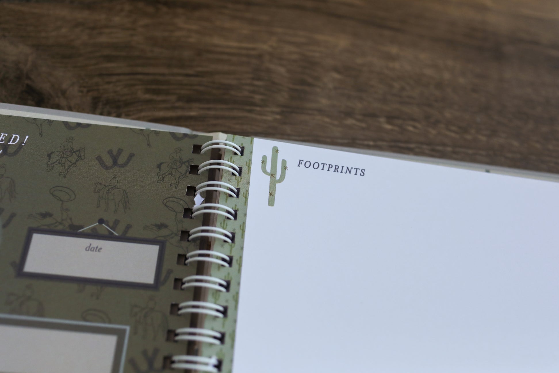 Spiral-bound notebook with a label on a wooden surface