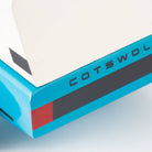 Close-up of a blue and white product with 'Cotswold' branding on a light gray background