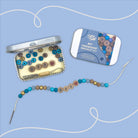 BFF Friendship Bracelet Kit with beads and tool on a blue background