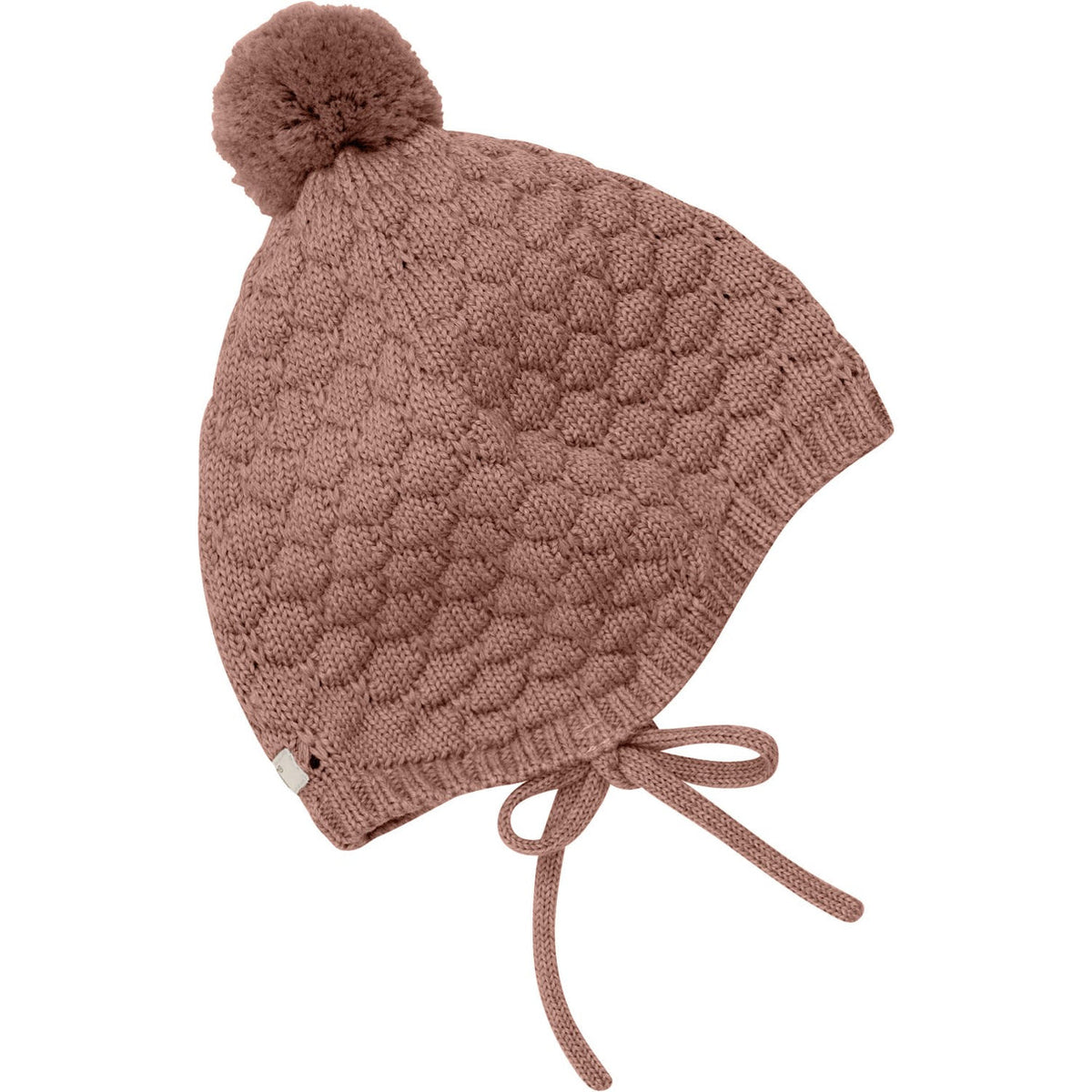 Knitted baby hat with pom-pom on a white background
