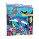 Sketchbook with ocean-themed cover featuring dolphins and sea creatures