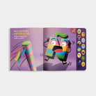 An open copy of "What Does Ñ Sound Like?: A Spanish-English Sound Book," showing an interior illustrated spread with the text "Does it sound like la PIÑA, when it gets hit with a stick?" on the left page, an animated piñata character reacting as a stick approaches on the right page, and a vertical panel of interactive sound buttons along the right edge.