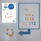 Colorful 'BFF' friendship bracelet kit with instructions and materials on a gray background