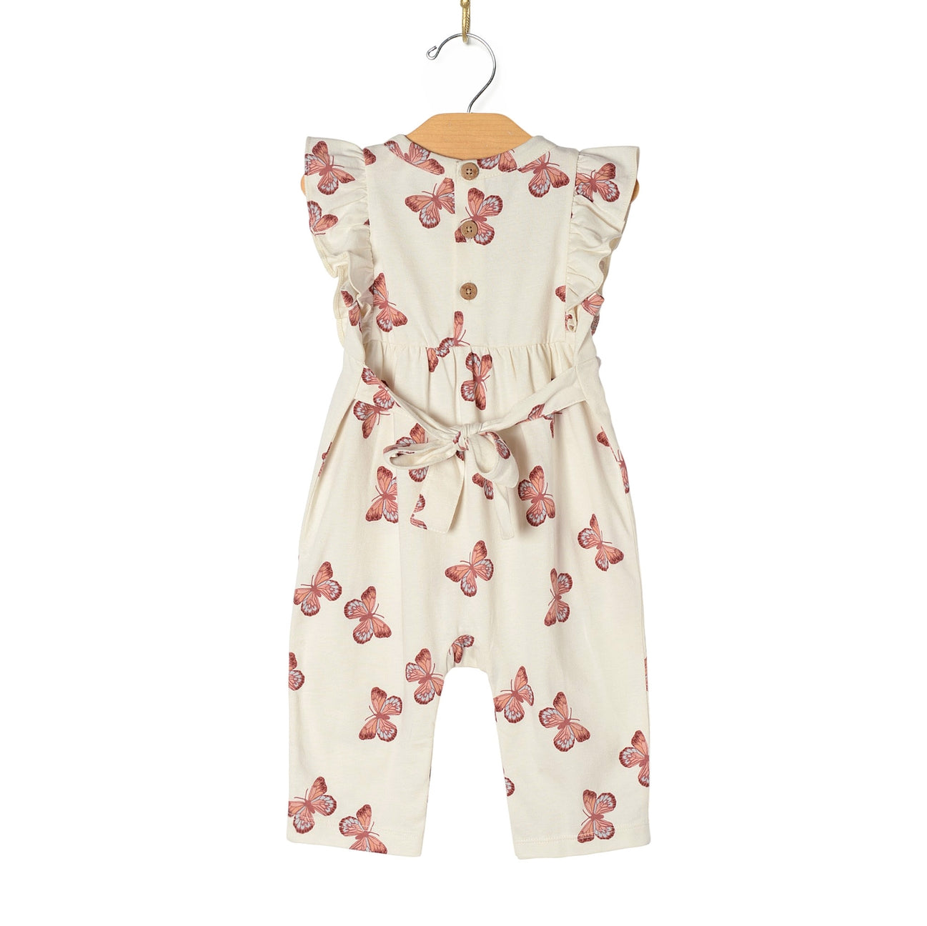 White baby romper with pink butterfly pattern on a hanger against a white background