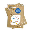 Three kraft paper packaging cards for 'Cotton Twist' friendship bracelet kits, stacked slightly offset on a white background. The top card features a blue circular label reading 'BFF FRIENDSHIP BRACELET' and a clear window displaying colorful beads and wooden letter beads spelling 'BFF'.