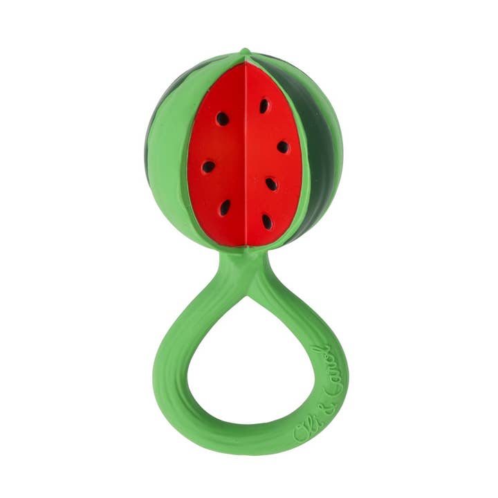 A green silicone baby teether shaped like a watermelon slice, featuring a red center with black seed details and a green handle, shown on a plain white background.