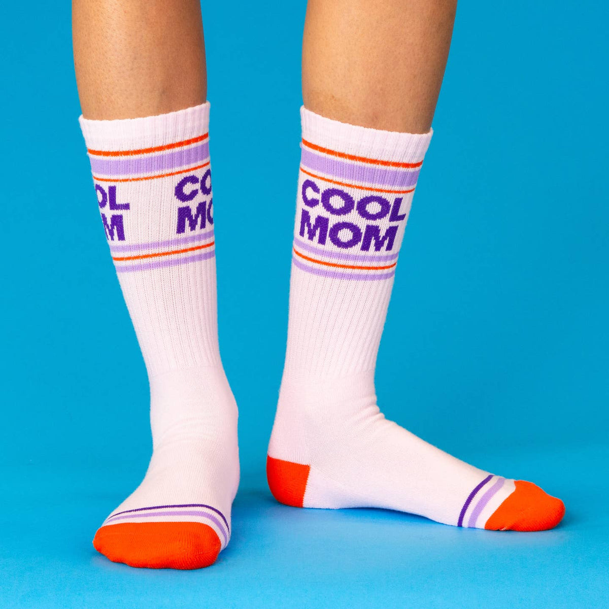 White socks with 'COOL MOM' text on a blue background