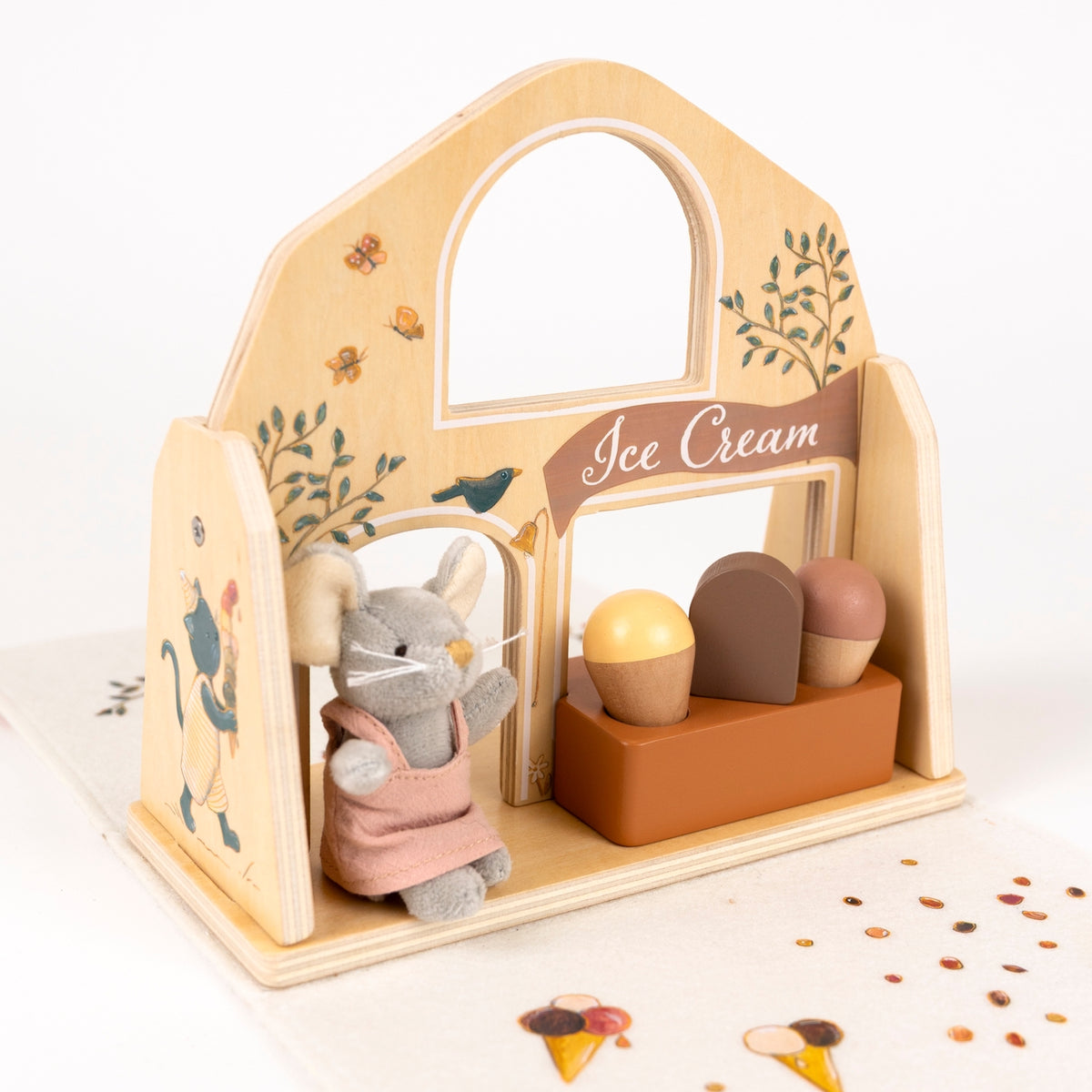 Wooden toy ice cream stand with a mouse character and ice cream cones on a white background