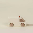 Wooden toy car on a beige background