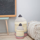 Textured cylindrical objects with a blackboard in the background