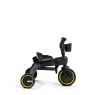 Black and yellow children's tricycle on a white background