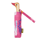 Pink umbrella with a wooden handle shaped like a duck on a white background